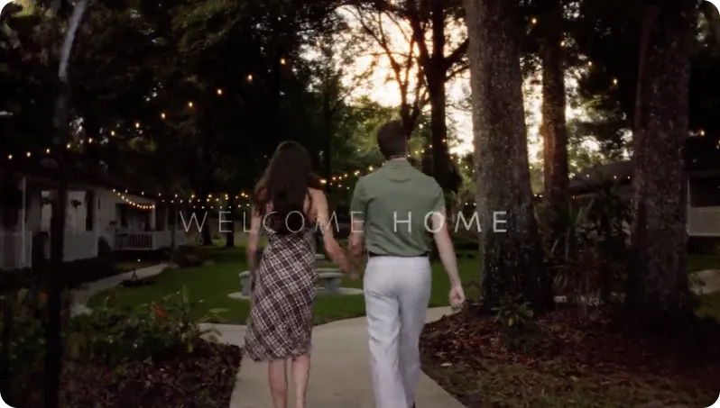 Couple walking around a boutique hotel stay at dusk